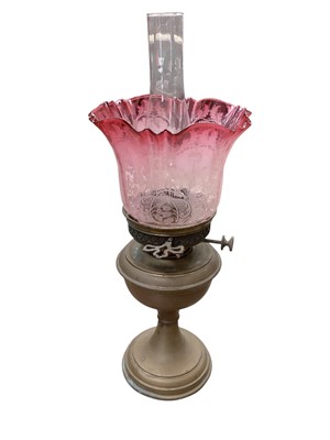 Lot 2699 - Brass oil lamp, together with six oil lamp chimneys and three glass shades including a cranberry and a green glass example.