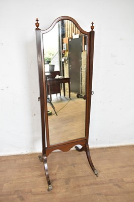 Lot 1222 - Early 20th mahogany cheval mirror, with arched plate raised on splayed supports and castors, 164 x 57cm
