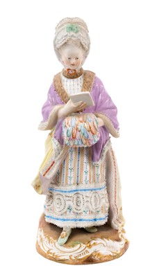 Lot 85 - Meissen figure of the Racegoer's Companion, 19th century, wearing a fur-lined lilac cloak over a striped floral dress, her left hand tucked inside a muff of brightly coloured feathers, a sealed...