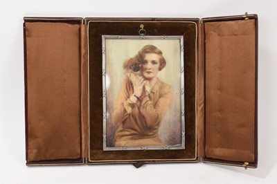 Lot 765 - Good quality 1920s portrait miniature on mica depicting a lady with her Pekingese, in fitted leather case