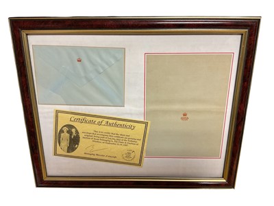 Lot 64 - Wallis, Duchess of Windsor, crested piece of stationery and matching envelope with embossed crown to flap in glazed frame with certificate of authenticity. The frame 32 x 40cm