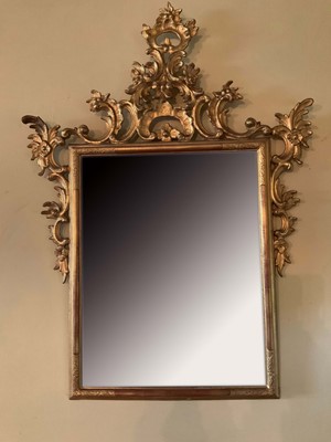 Lot 1275 - Antique Continental rococo gilt wall mirror, with later rectangular bevelled plate in tooled slip frame with pierced C-scroll surmount