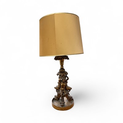 Lot 1279 - Pair of decorative gilt table lamps, each with figural supports and dished circular bases