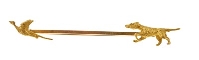 Lot 401 - Edwardian gold novelty hunting brooch in the form of a pointer with a pheasant in flight, the bar stamped 15ct.