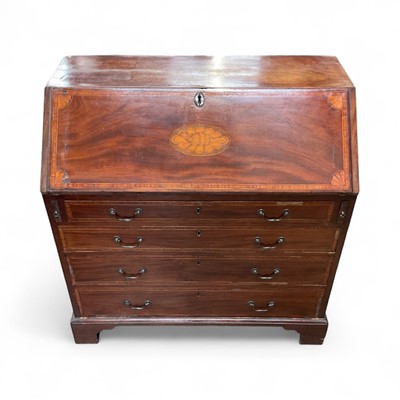 Lot 1283 - George III mahogany and satinwood banded bureau, with patera inlaid fall enclosing fitted interior and four long drawers below on bracket feet
