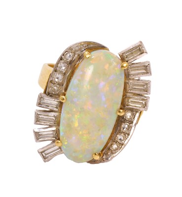 Lot Opal and diamond cocktail ring with an oval opal cabochon surrounded by baguette cut and single cut diamonds in gold and platinum setting on tapered gold shank