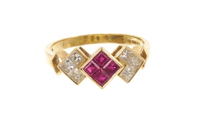 Lot Ruby and diamond ring with three geometric clusters of calibre cut rubies and princess cut diamonds in gold rub-over setting on 18ct gold shank, Lon...