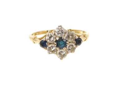 Lot 409 - Sapphire and diamond cluster ring with a flower head cluster of mixed cut blue sapphires and brilliant cut diamonds in claw setting on tapered shank