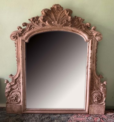Lot 1285 - 18th / 19th century Continental rococo carved overmantel mirror, of arched outline in ornate scroll carved frame