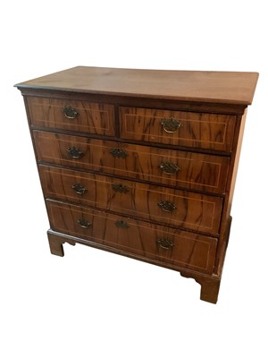 Lot 1286 - Mid 18th century walnut and oak chest of drawers, with two short over three graduated crossbanded drawers on bracket feet