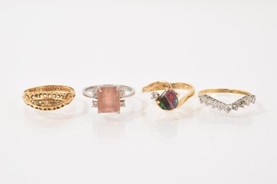 Lot 412 - Four gold and gem-set dress rings
