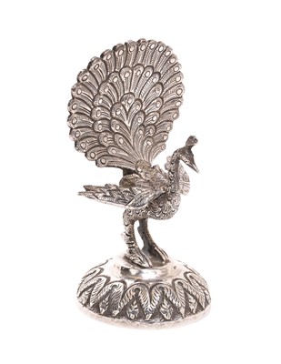 Lot 273 - Late 19th century Anglo-Indian silver menu holder in the form of a peacock, apparently unmarked, 8.5cm in overall height.