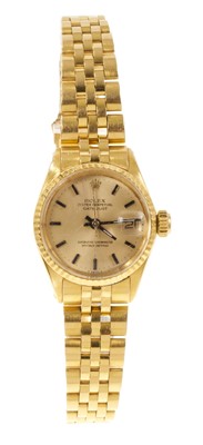 Lot Ladies Rolex 18ct gold Oyster Perpetual Datejust wristwatch with gold dial and date aperture, on 18ct gold Jubilee bracelet with spare links