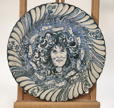 Lot 944 - *Mary Millar Watt (1924-2023) hand painted ceramic plate decorated with a portrait of Anita Roddick, signed and titled verso, 30.5cm diameter