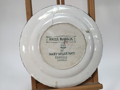 Lot 944 - *Mary Millar Watt (1924-2023) hand painted ceramic plate decorated with a portrait of Anita Roddick, signed and titled verso, 30.5cm diameter