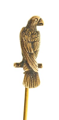 Lot 440 - Victorian yellow metal novelty stick pin, the finely cast exotic bird/parrot on a perch, 86mm.