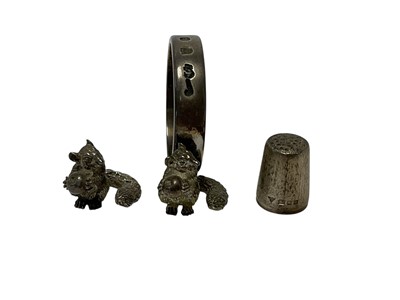 Lot 214 - Brian Leslie Fuller (B. 1942), contemporary silver napkin ring, set with Fuller's trademark Gils Gils Dormouse, (London 2002) together with another contemporary silver cast model of Gils Gils Do...