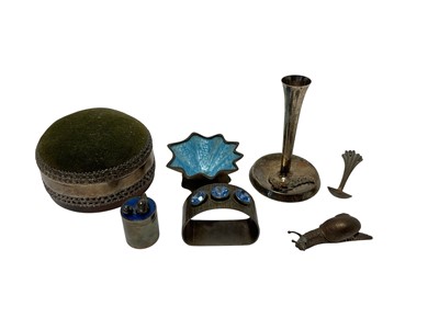 Lot 222 - Collection of contemporary silver items to include a silver mounted pin cushion, (London 1985), maker VAJ, silver model of a snail, (London 1996), maker Nicholas Plummer, silver bark effect napk...