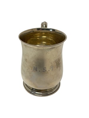 Lot 228 - George V silver tankard of baluster form, with engraved initials, scroll handle and raised on a circular foot, (Birmingham 1918), maker William Hutton and Sons, 11.8cm in overall height, all at...