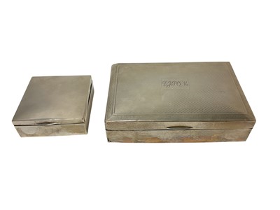 Lot 237 - George V silver cigarette box of square form (London 1919), together with a larger rectangular silver cigarette box, (marks rubbed) (2).