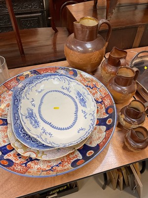Lot 5016 - Large Imari charger, three Victorian meat plates, and a set of five 19th century graduated salt glazed stoneware jugs