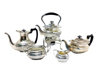 Lot 267 - Late Victorian five piece silver tea and coffee set, with gadrooned edge, half reeded body and engraved family crest, by Hawksworth, Eyre & Co Ltd, (London 1897)