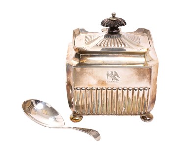 Lot 285 - Late Victorian silver tea caddy of rectangular form, with hinged lid, half reeded body and engraved family crest on four bun feet, (Sheffield 1897), maker Henry Stratford, 10.5cm