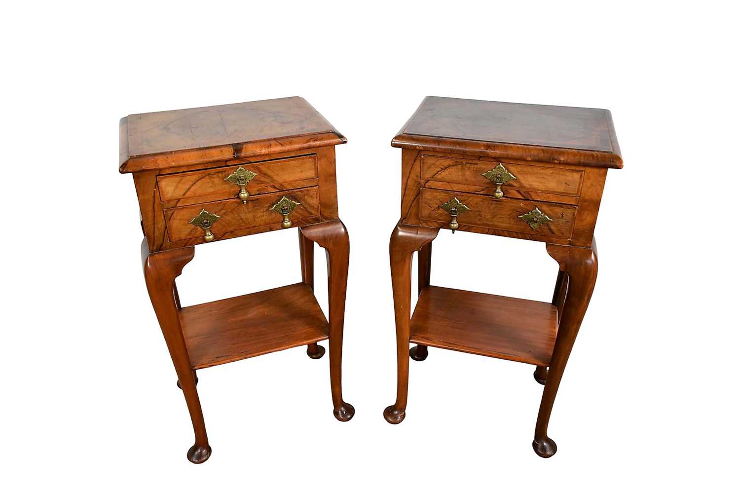 Lot 1233 - Pair of Queen Anne revival crossbanded walnut two tier bedside chests with drop brass handles