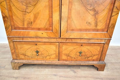 Lot 1234 - Queen Anne revival figured walnut wardrobe with two drawer base