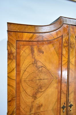 Lot 1234 - Queen Anne revival figured walnut wardrobe with two drawer base