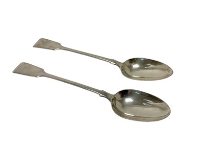 Lot 320 - Pair of Victorian silver fiddle pattern basting spoons with engraved family crests, (London 1870), maker Holland, Aldwinkle & Slater, 30.5cm.