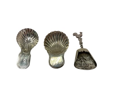 Lot 341 - George III silver caddy spoon with scalloped shell shaped bowl and bright-cut handle, (London 1791), maker George Smith & William Fearn, another similar, (Sheffield 1790) and a Dutch