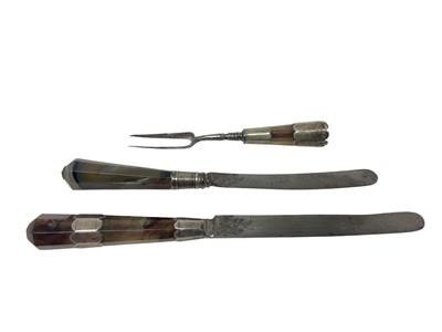 Lot 342 - Early 18th century two-pronged fork and two similar knives, with silver mounted agate handles (3)