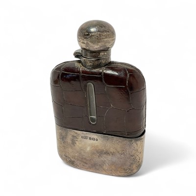 Lot 345 - Late Victorian silver mounted glass and crocodile leather hip flask with bayonet fitting and detachable cup, (Sheffield 1899), maker James Dixon & Sons, 14cm overall height.