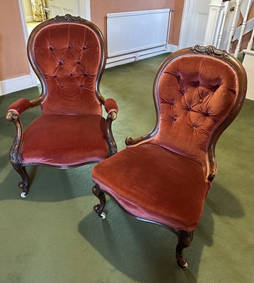 Lot 1358 - Pair of Victorian mahogany framed ‘his and hers’ spoon back chairs with buttoned back velvet upholstery, on carved cabriole legs and castors