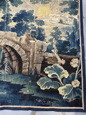 Lot 1502 - Flemish, late 17th / early 18th century Verdure tapestry depicting a sunrise over a bridge Provenance: Joanna Booth, Kings Road, London, 29th September 1990