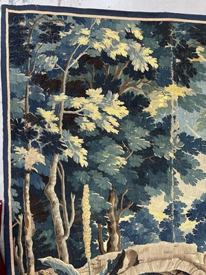 Lot 1502 - Flemish, late 17th / early 18th century Verdure tapestry depicting a sunrise over a bridge Provenance: Joanna Booth, Kings Road, London, 29th September 1990