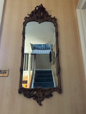 Lot 1506 - 19th century Continental carved fruitwood framed wall mirror in the rococo style, with foliate leaf scroll crestings