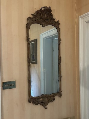Lot 1506 - 19th century Continental carved fruitwood framed wall mirror in the rococo style, with foliate leaf scroll crestings