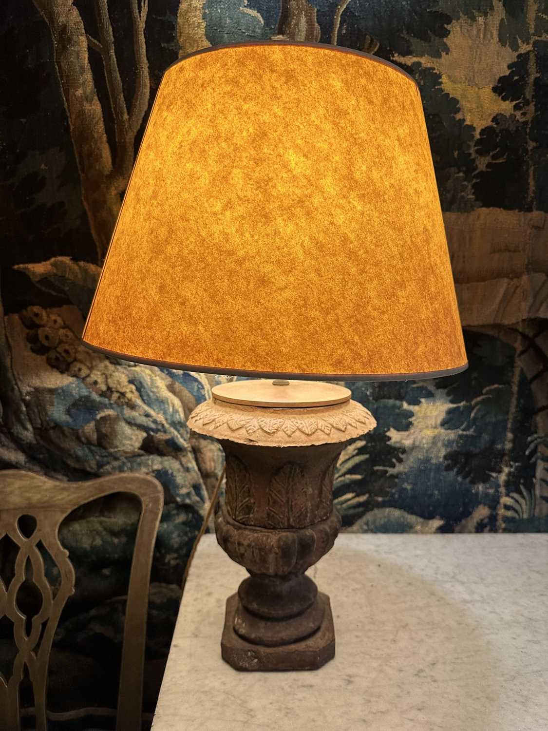 Lot 1509 - Pair of terracotta campana shape urns with stiff leaf and lobed decoration on chamfered square bases, now as table lamps