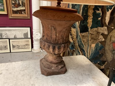 Lot 1509 - Pair of terracotta campana shape urns with stiff leaf and lobed decoration on chamfered square bases, now as table lamps
