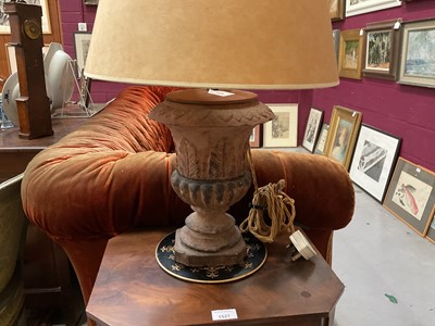 Lot 1509 - Pair of terracotta campana shape urns with stiff leaf and lobed decoration on chamfered square bases, now as table lamps