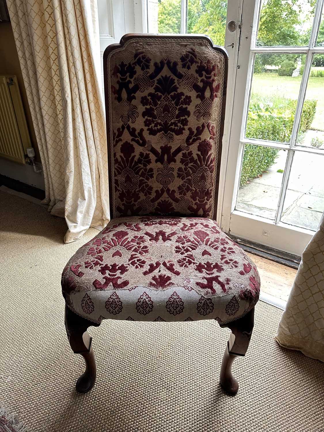 Lot 1524 - Queen Anne walnut high back side chair with show-wood frame, carved cabriole legs and pad feet, upholstered partially in cut velvet damask
