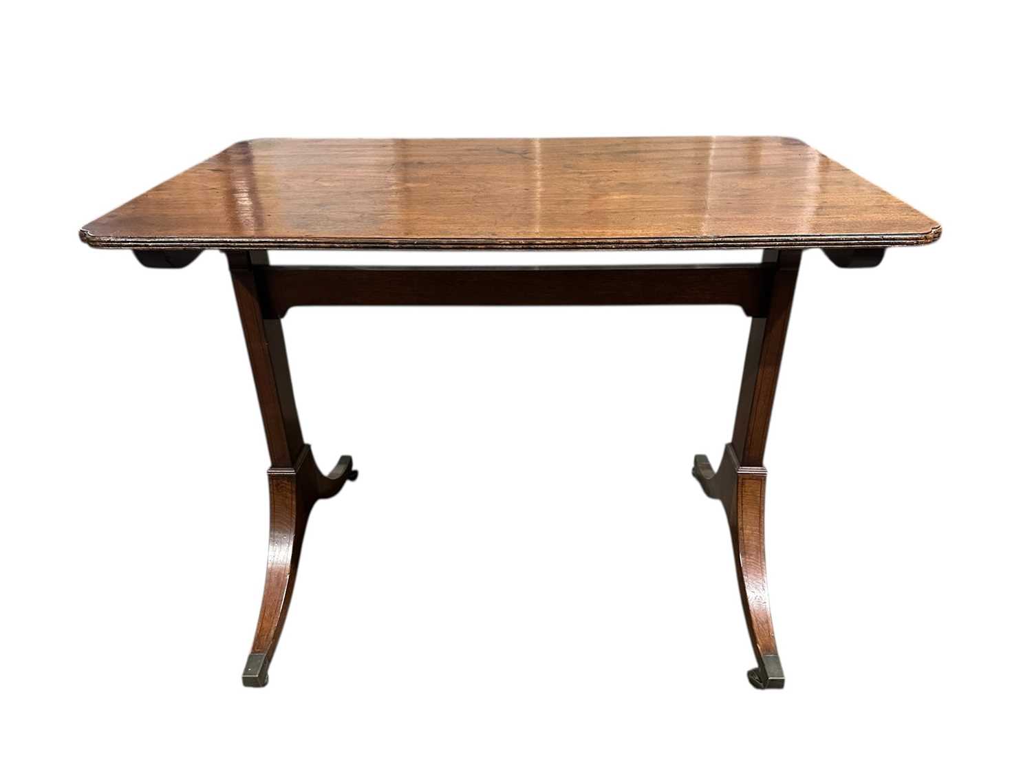 Lot 1526 - George IV mahogany table with shaped rectangular top above straight supports on splayed legs and brass capped castors, 91cm wide