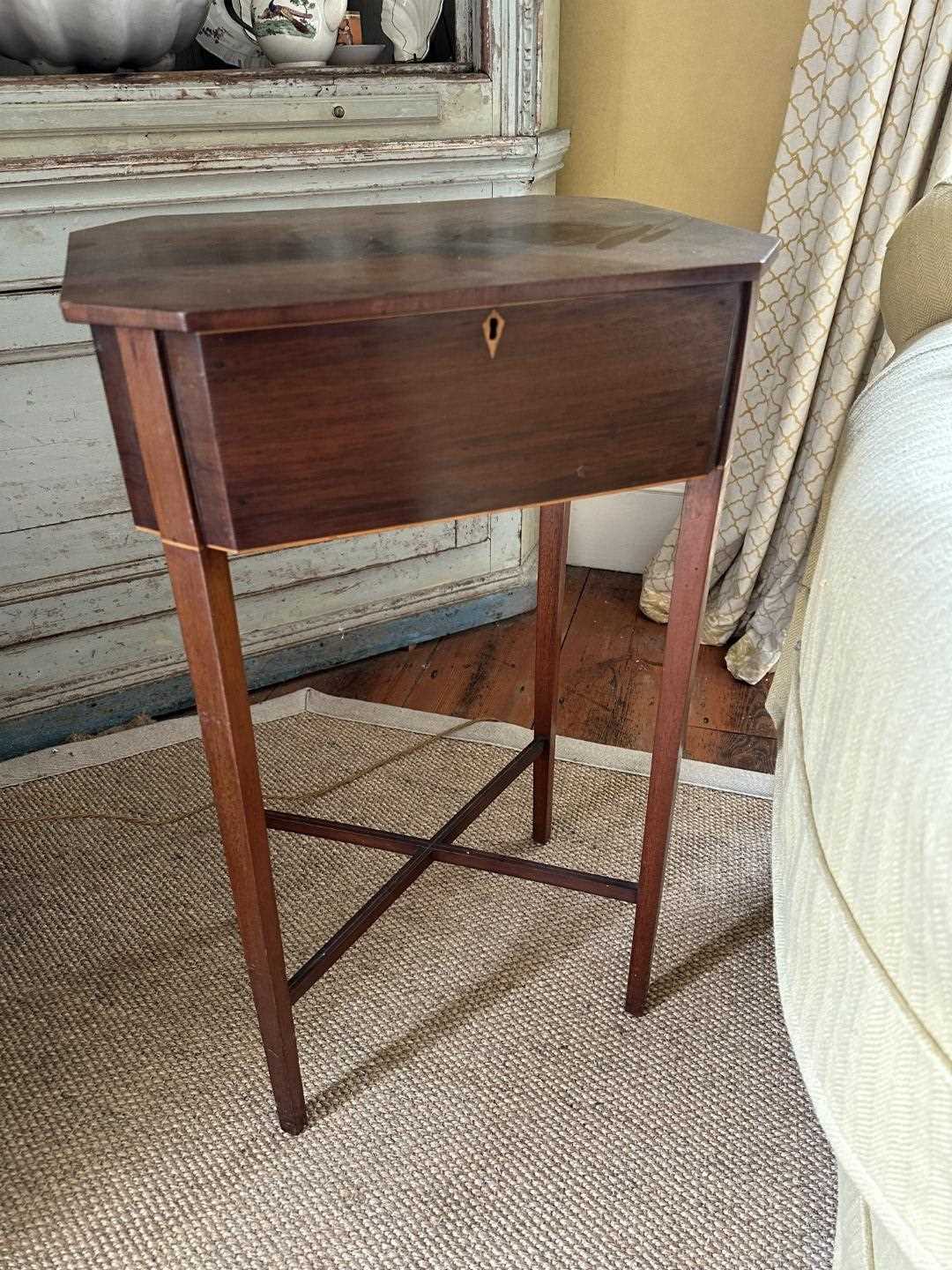 Lot 1527 - Regency mahogany sewing table, the octagonal top rising to reveal...on square taper legs joined by X-formed stretcher