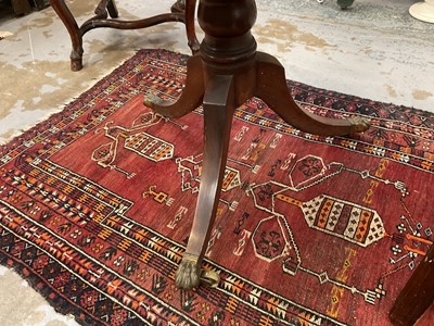 Lot 1529 - 19th century mahogany drum table with crossbanded top and an arrangement of drawers, on turned column and three splayed legs terminating on brass paw castors