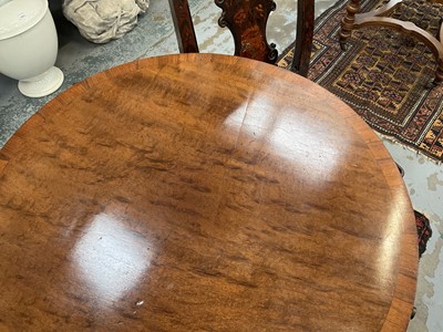 Lot 1529 - 19th century mahogany drum table with crossbanded top and an arrangement of drawers, on turned column and three splayed legs terminating on brass paw castors