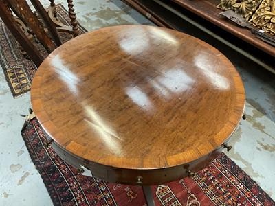 Lot 1529 - 19th century mahogany drum table with crossbanded top and an arrangement of drawers, on turned column and three splayed legs terminating on brass paw castors
