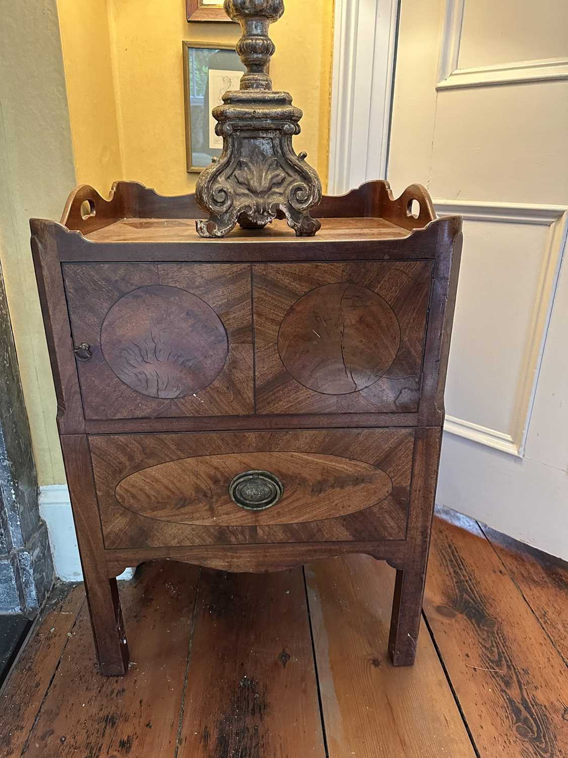 Lot 1533 - George III mahogany night table with gallery top above twin cupboard doors