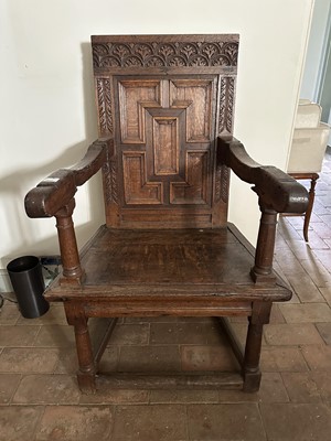 Lot 1637 - 17th century and later oak elbow chair, the panelled square back above a solid seat, turned supports joined by stretchers